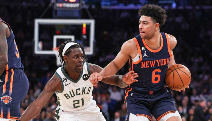 Jrue Holiday (21) guards Knicks backcourt man Quentin Grimes (6)